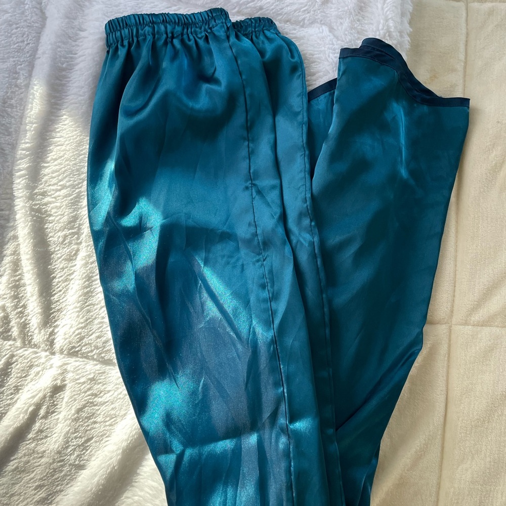 Vintage Victoria’s Secret blue silk like set top and bottom. Size small/medium.